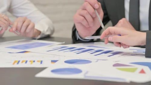 Close up of Business People Working on Documents