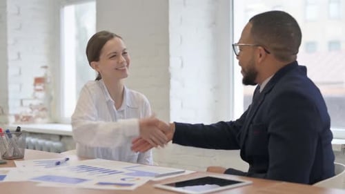 Multi Ethnic Business People Shaking Hand in Office