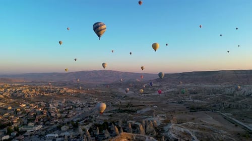hot air balloons flying in the sky of Cappadocia at dawn - Göreme, Turkey