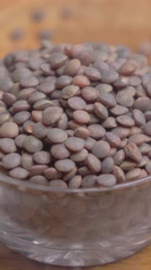 Lentils in a Glass Bowl on Wood