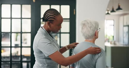 Healthcare, back massage and chiropractor with senior woman in office for injury rehabilitation