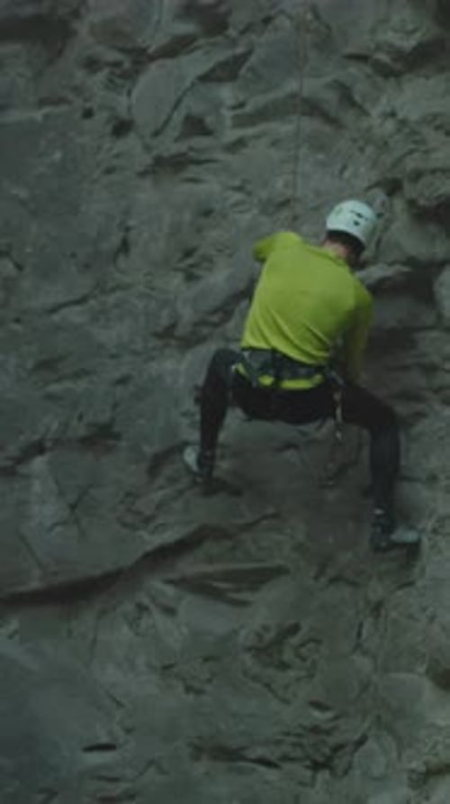 Climber Practicing Skills Rock Climber with Safety Gear Athlete Performing Precise Climbing