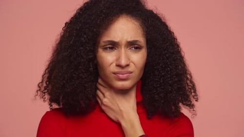Young Adult Woman Experiencing Throat Pain