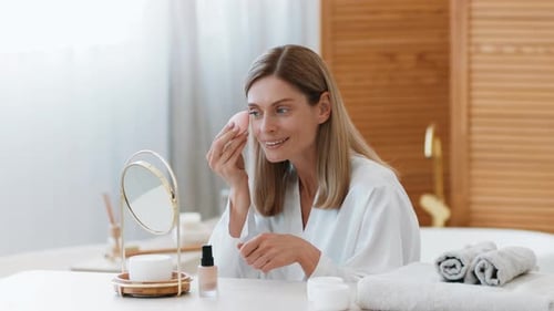 Woman Preparing Skincare Routine at Home Using Natural Products