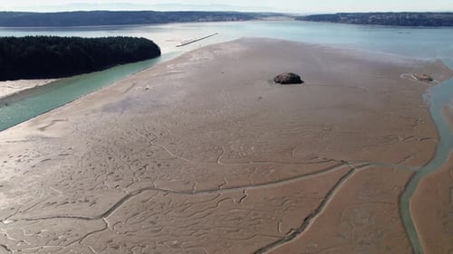 Drone Looking Down On Unique Tidal Channel Textures In Ocean Mud Flats
