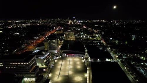 Aerial view of city buildings at night, United States.