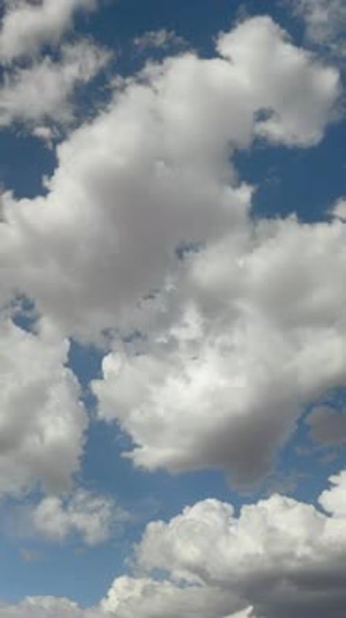 Storm Clouds in a Blue Sky Vertical Background