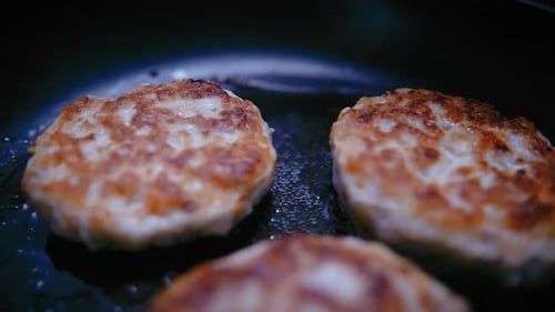 Sizzling Delights Slowmotion Shots of Juicy Meat Cutlets on a Frying Pan
