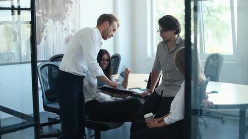 Young Adults Collaborate in Modern Office Environment