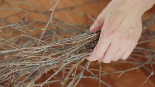 Closeup View of Pile of Dry Thin Branches on Wooden Table