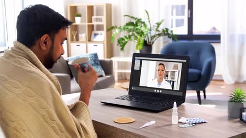 Man video conferencing with female doctor, telehealth concept