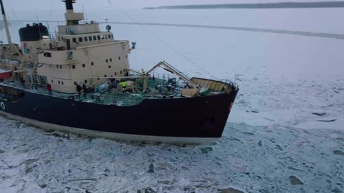 Icebreaker Ship Cutting Through Icy Frozen Sea