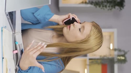 Young Woman Working From Home, Talking on Phone