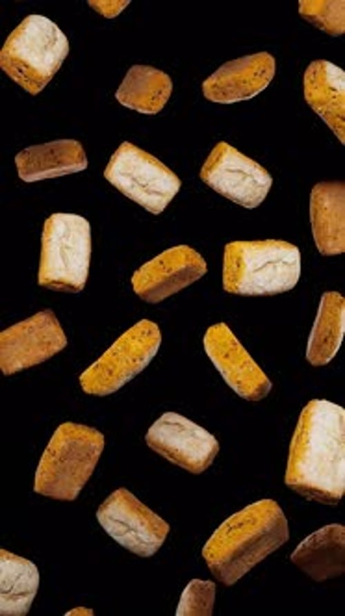 Falling Golden Croutons and Bread Pieces Vertical Animation