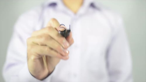 Man Writes "Stop Racism" on Clear Surface