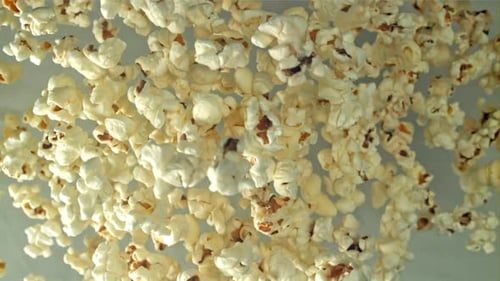 Popcorn Flies Up and Falls Down On a Light Background Filmed on a Highspeed Camera at 1000 Fps