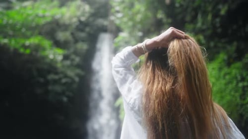 Carefree Blonde Woman in Straw Hat Admire View Mountain Waterfall in Wild Nature Girl Tourist in