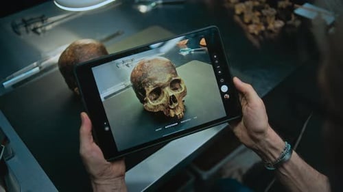 Archaeologist Photographs Fossil Skull of Ancient Extinct Human in Tablet