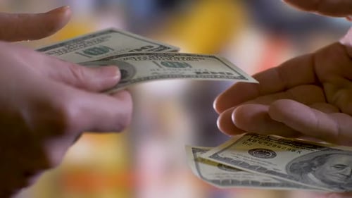 Hands Counting Hundred Dollar Bills, Close Up