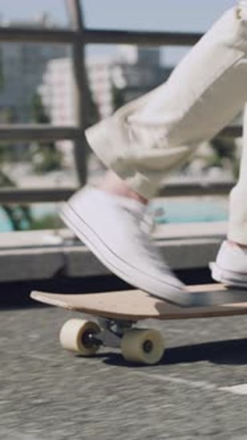 Legs, person and skateboard on bridge in city for commute, eco friendly transport and balance