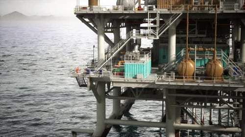 Aging Oil Rig Stationed in Vast Ocean Waters