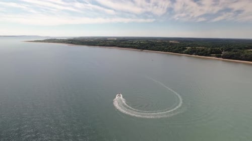 Speedboat Leaving Backwash On The Solent Strait Near The Calshot In The United Kingdom. - aerial