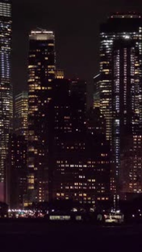 Manhattan Urban Cityscape at Night New York City View From the Water Vertical Video
