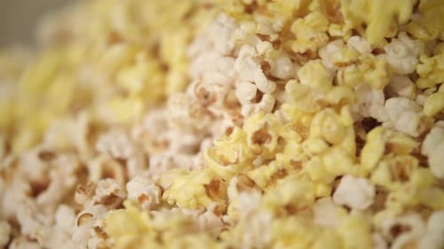Ready Popcorn Falling in Popcorn Machine. Popcorn Production Process. Close Up Of