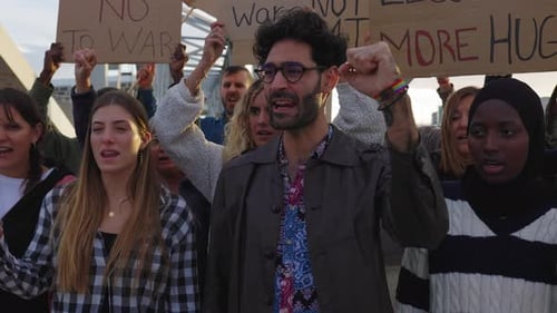 Crowd Protesting and Chanting Together in an Urban Setting