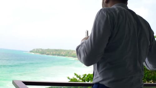 Businessman Listening To Music On Cellphone And Dancing On Terrace, Super Slow Motion 240fps