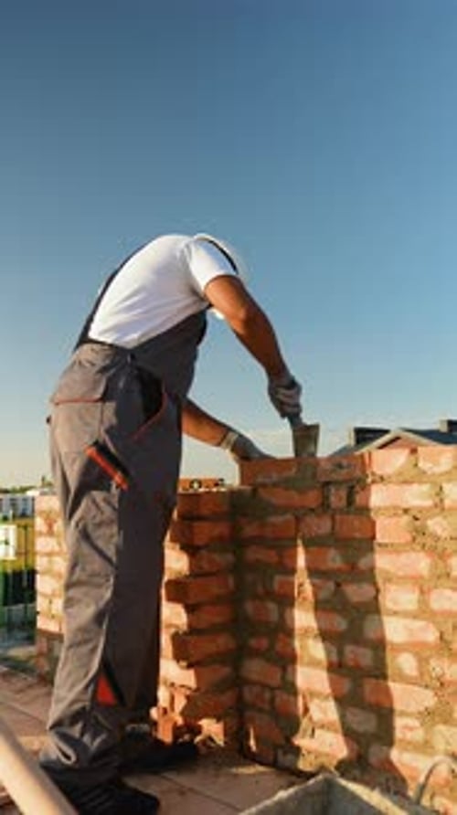 Indian Builder Carefully Constructs a Residential Wall