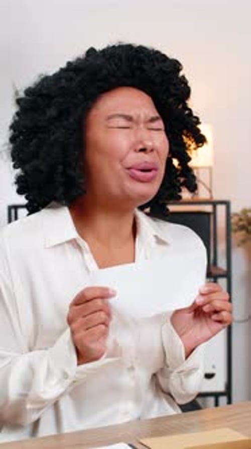 Excited Woman Opens Letter, Receives Good News