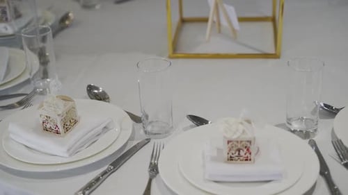 A close-up of dinning table at the wedding event in the banquet.