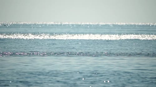 Sea Water Surface Low Angle View Over Clear Azure Sea Water Sun Glare Abstract Nautical Summer Ocean