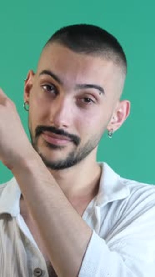 Young Adult Male Posing with Arm Raised