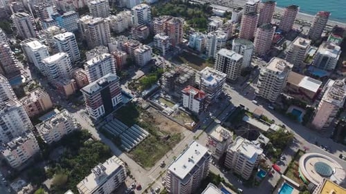 Aerial View A Large Construction Project in Motion with Concrete Pouring Workers Shaping the