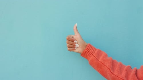 Thumbs up, thumb or hand of woman on blue studio background mockup