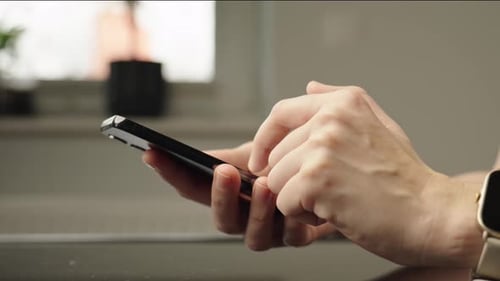 Hands Using Smartphone with Smartwatch