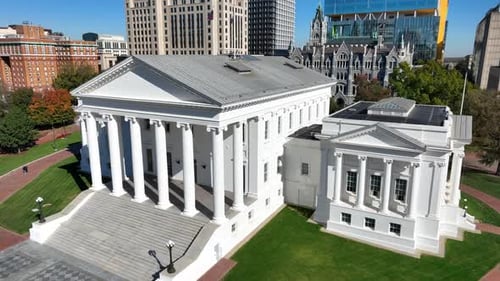 Virginia capitol building. Aerial orbit around prestigious white-pillar government state house. Down