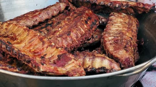 Grilled Pork Ribs Closeup Pork Ribs on a Rotating Grill Closeup Delicious Juicy Pork Ribs on a