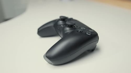 Close-up: gamepad or joystick lies on the table