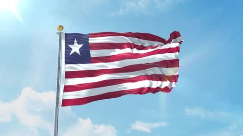 Liberian Flag Waving on Flagpole Against Blue Sky