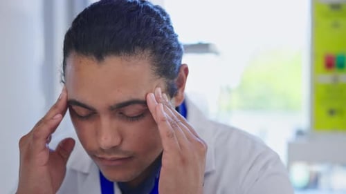 Man with headache, scientist in laboratory and stress, fatigue and massage temple with work burnout