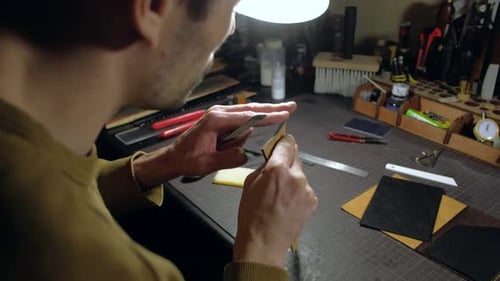 Person Tailor Who Works with Leather in Workplace