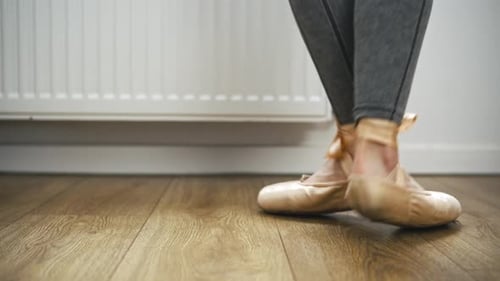 Ballerina Feet Practicing on Pointe in Dance Studio