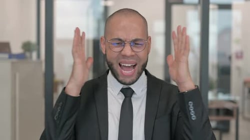 Stressed Man Shouting in Office Environment