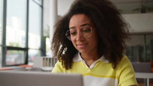 Happy African American Woman Female Student Girl in School University College Academy Looking at
