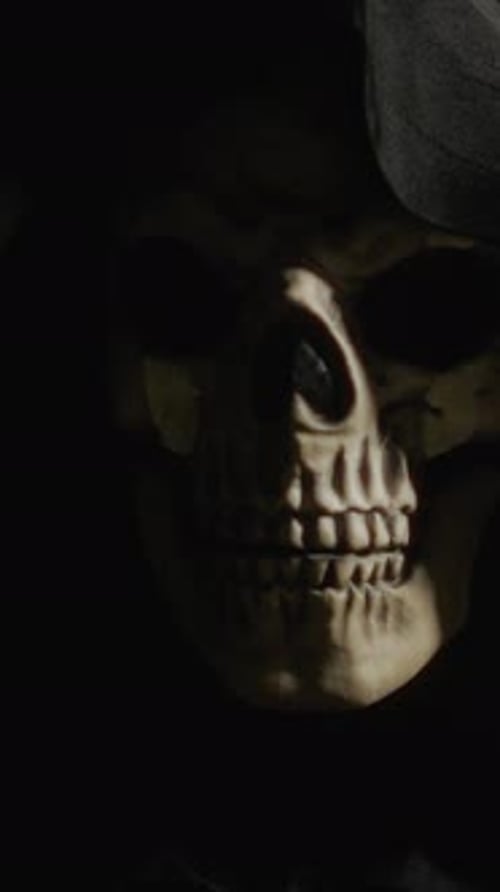 Black Hooded Death At Night In A Forest During Halloween Holiday