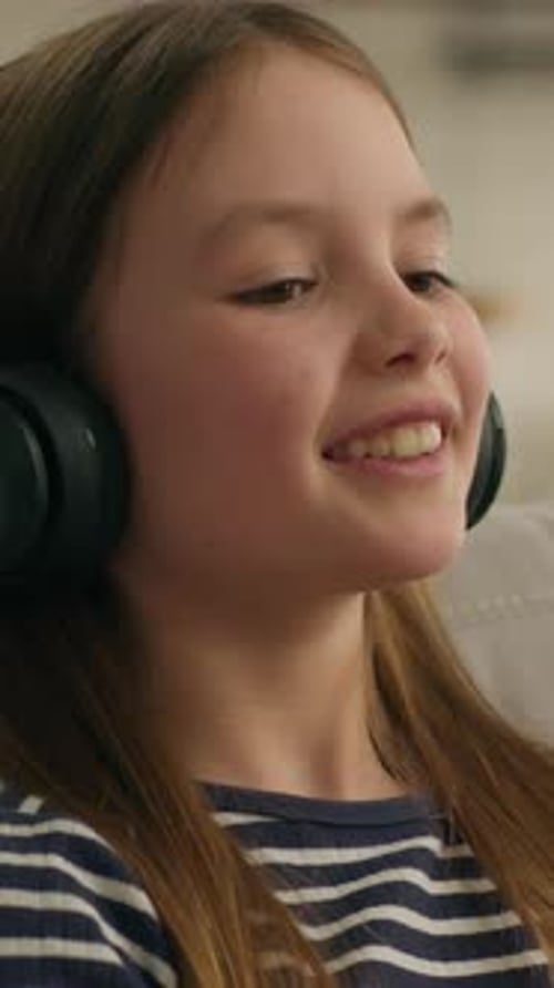 Girl With Headphones Indoors, Smiling