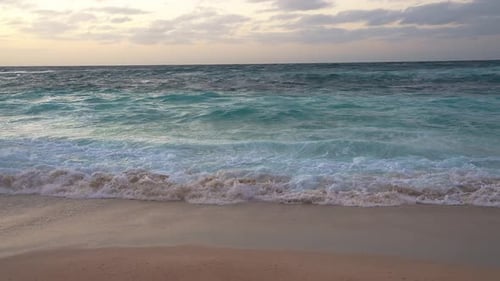 Serene Beach at Sunset with Gentle Waves in Hawaii